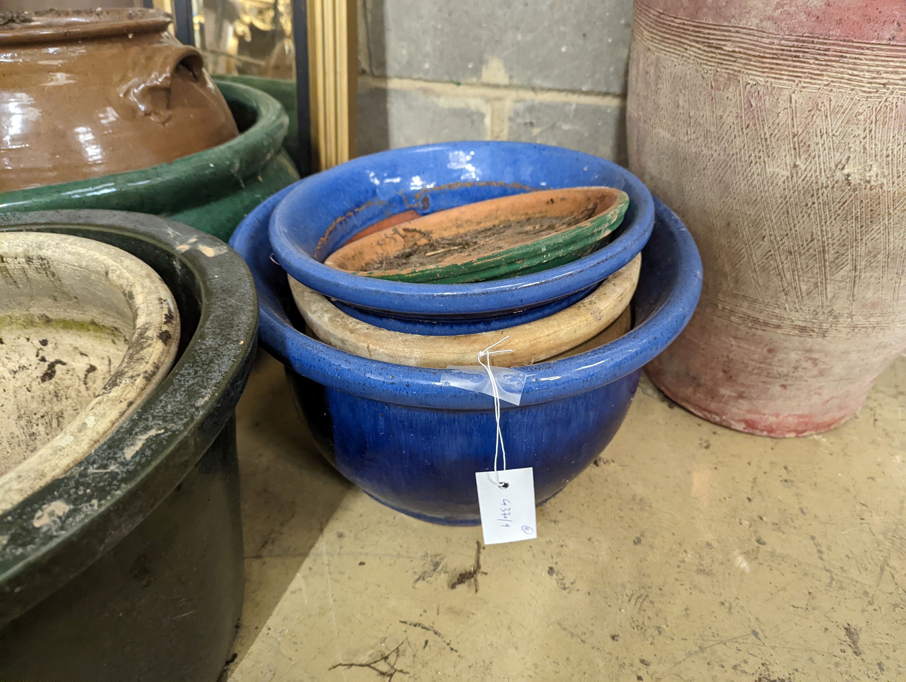 Nine earthenware garden planters, largest diameter 42cm